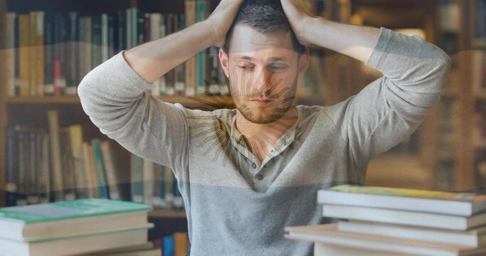 Animation of flag of argentina over stressed male student studying library holding head