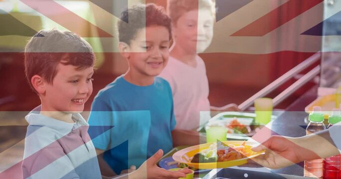 Animation Of Flag Of Uk Over Smiling Schoolboys In School Canteen