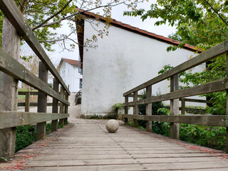 ball lying on a wooden bridge