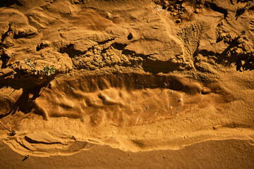 texture of a raised sand pit in the afternoon