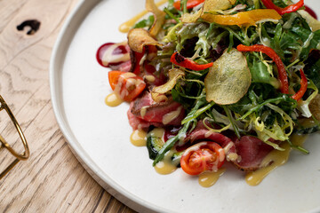 Potato chips salad with greens and cherry tomatoes, white wine pairing