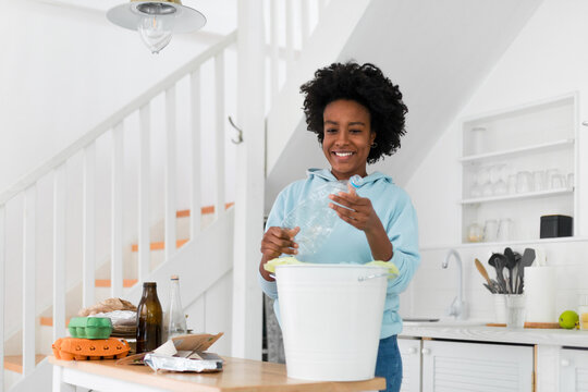 Woman Recycling at Home 