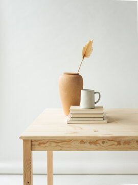 Minimal Table Scene with Pottery and Books 