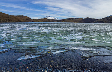 Winter in Patagonia: drift ice on a lake in the hills  © Chris