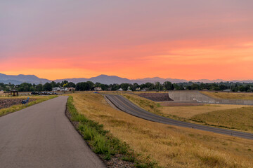 Summer Sunset - Colorful Summer sunset view at top of Chatfield Dam. Chatfield State Park,...