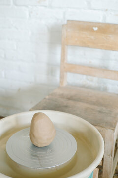 Pottery wheel with a piece of clay 