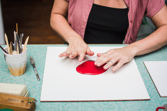 Woman creating jewelry from scratch