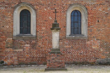 Missionary cross from 1841 in front of the Church of the Exaltation of the Holy Cross in Zakroczym, Poland 