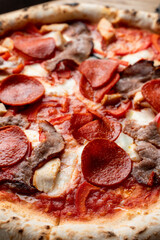 Huge hot meat pizza, appetizing bright and beautiful photo for social media