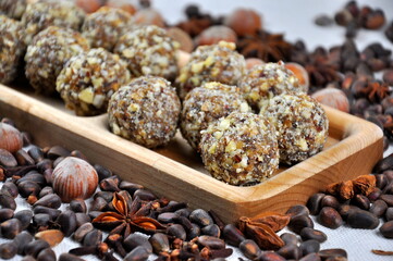 Homemade candy made from nuts on a wooden plate.