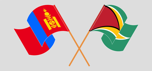 Crossed and waving flags of Mongolia and Guyana