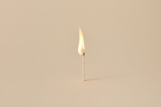 Burning match with flame