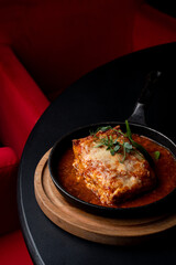 Side view ground beef lasagna with tomato sauce