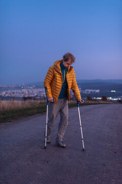 Man with paraparesis using crutches 