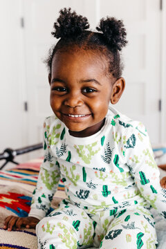 Portrait of an adorable little girl in pajamas. 