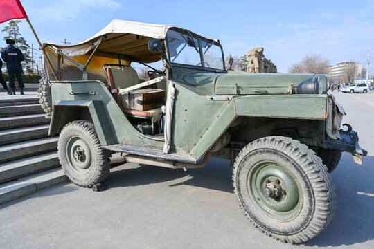 A military vehicle, an old military vehicle from the Second World War on a snow-covered city street. Soviet Two World War Four-wheel drive.