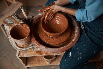 Image of process manufacturing ceramic tableware in pottery workshop