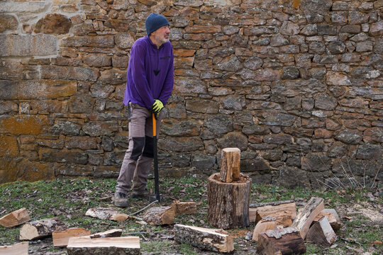 lumberman resting on axe
