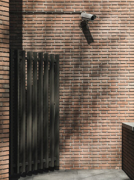 bricks wall with surveillance camera