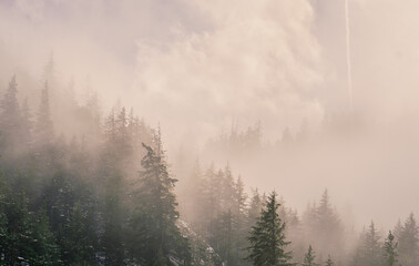 foggy mountain winter sunrise from far away