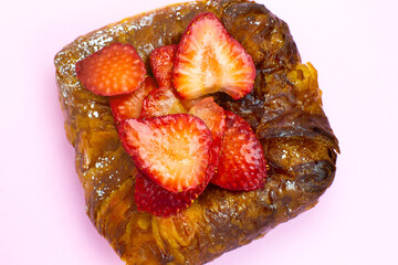 Puff pastry bun or roll. Cake with fresh strawberries. Delicious sweets temptation and desserts on...