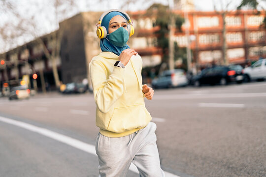 Young Muslim Woman Running