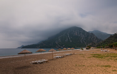 Morning on the beach in the village of Cirali. Blue bay in the Mediterranean at dawn. Landscapes of the Lycian Trail. May 2021. Long exposure picture