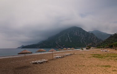 Morning on the beach in the village of Cirali. Blue bay in the Mediterranean at dawn. Landscapes of the Lycian Trail. May 2021. Long exposure picture