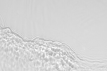 Desaturated transparent clear calm water surface texture with ripples, splashes Abstract nature...