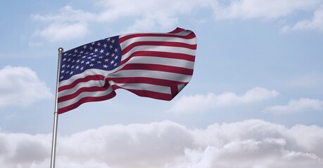 Composition of billowing american flag on flagpole over cloudy blue sky