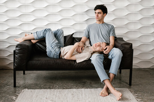 Young man sleeping on lap of boyfriend