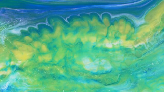 Abstract light pastel streams flow along the plane on a blue background. Marble texture. Fluid art. Liquid abstractions.