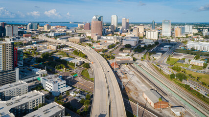 Cinematic drone shot over the Selmon Expressway leading through downtown Tampa.