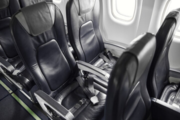 Passanger seats in salon of passenger airplane jet