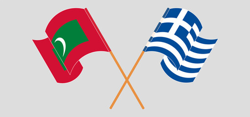 Crossed and waving flags of Maldives and Greece