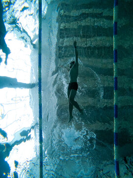 young man training in the pool