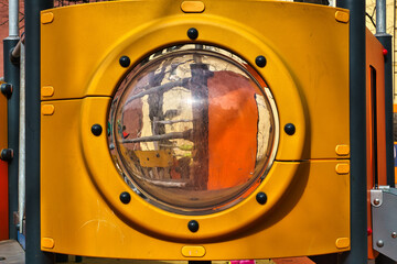 porthole in the kid`s yellow submarine