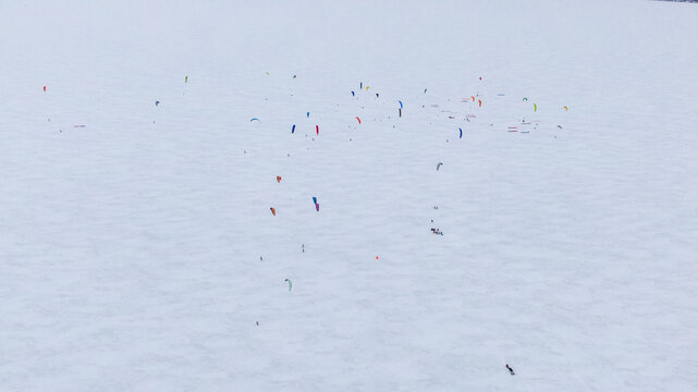 group of kiteboarders training on the ice