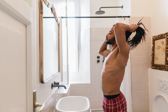Guy in the bathroom during morning cleaning