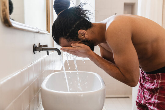 Guy in the bathroom during morning cleaning