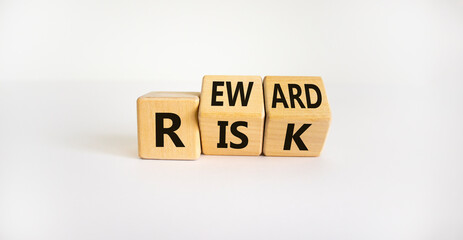 Risk or reward symbol. Turned wooden cubes and changed the word 'risk' to 'reward'. Beautiful white...