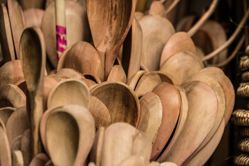 wooden spoons on a wooden background