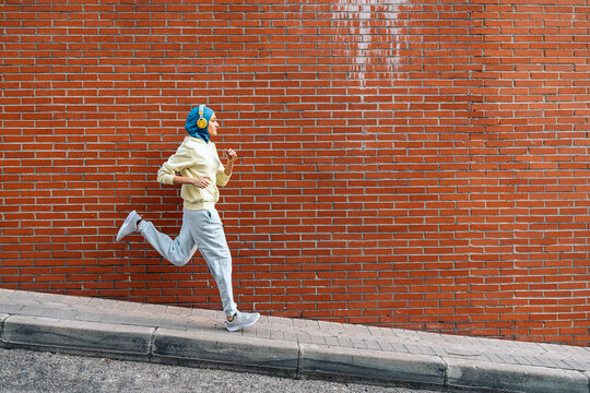 Young Muslim Woman Running