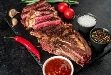 grilled cowboy beef steak on stone background