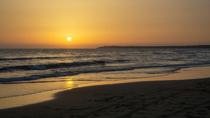 Cadiz beach at sunset in the golden hour