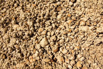 Ready to use the construction mixture in the form of stones mixed with concrete solution.