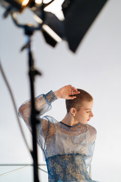 Fashion photo with a bald non-binary model