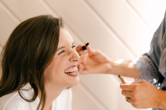 bride getting make up done