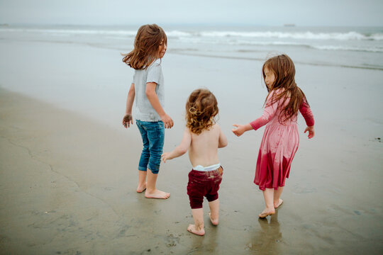Young children playing on the beach