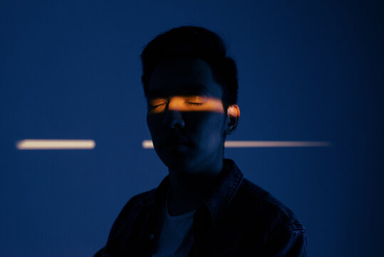 Portrait of a man with his eyes closed 